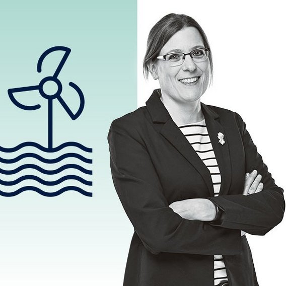 Portrait of Dr. Britta Schacht with wind turbine on water icon in the background